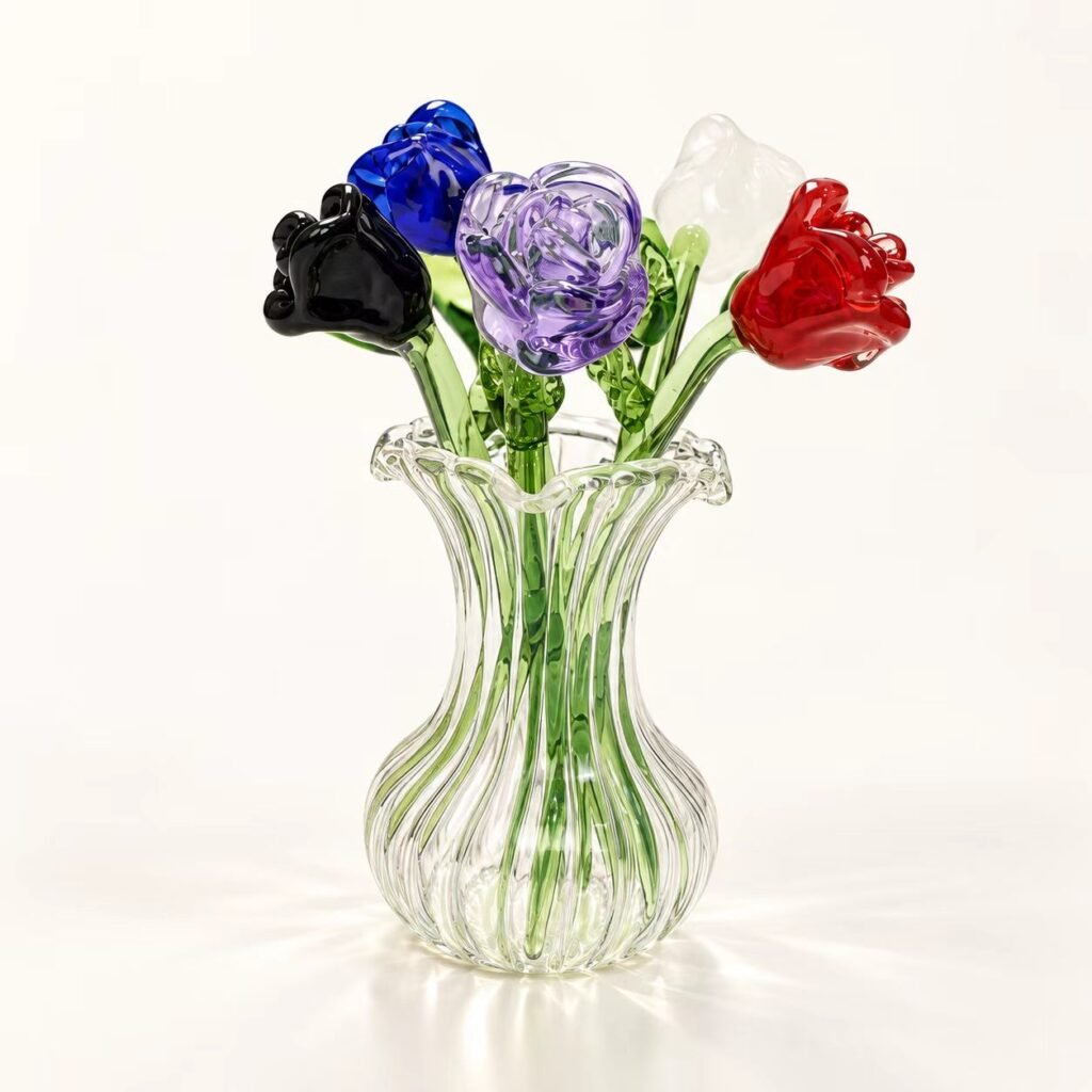 Colorful handmade glass rose bouquet displayed in a clear ribbed glass vase